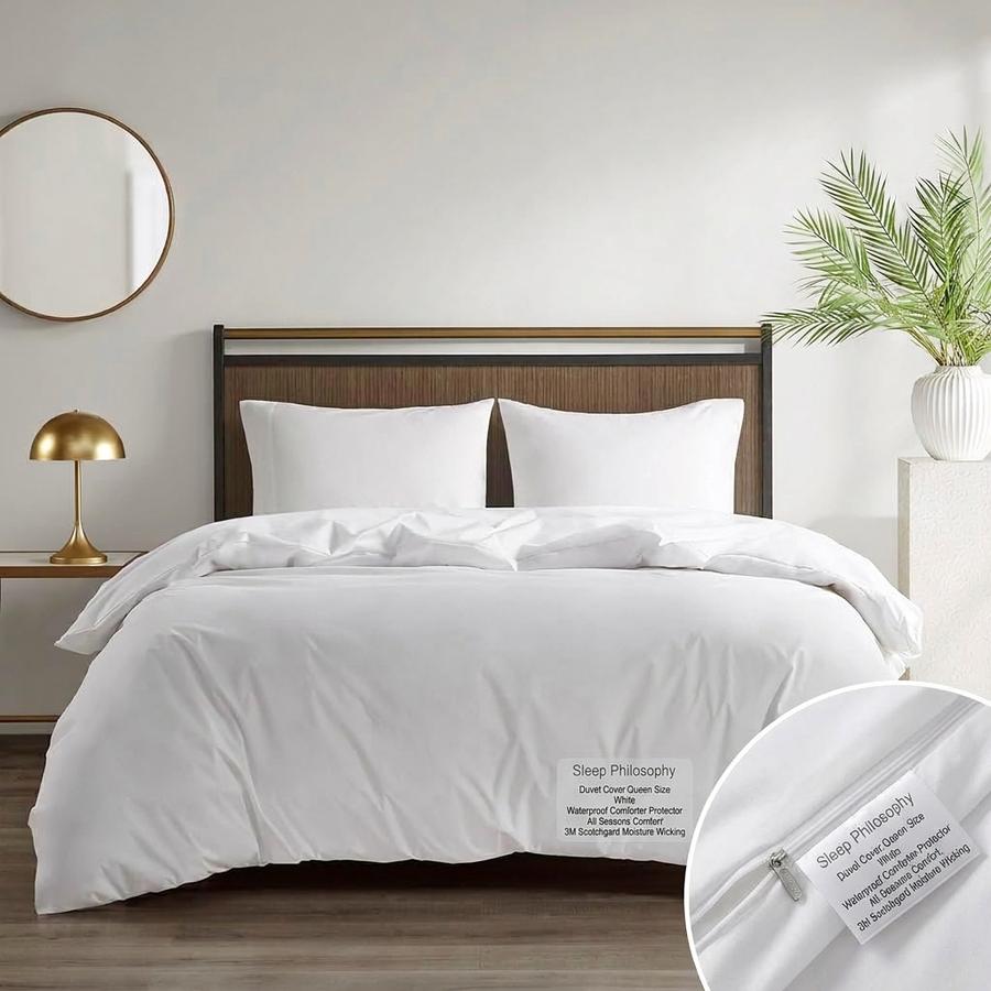 Waterproof Duvet Protector covering a comforter on a neatly made bed